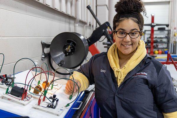 Fox Valley Tech student standing in a training shop