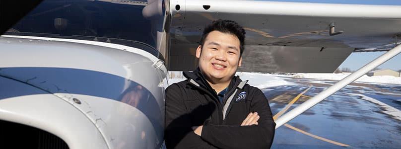 student working on airplane mechanics