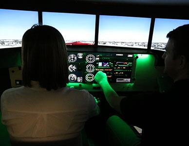 student and instructor in plane cockpit