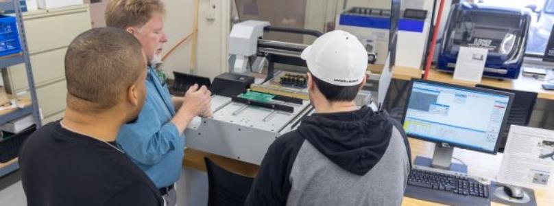 Engineering student working in an electronics lab