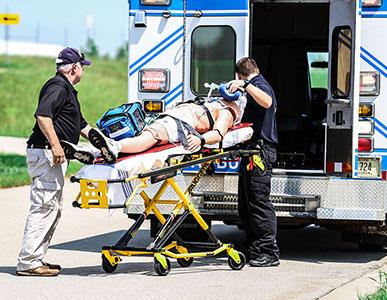 Demo of two students loading a patient in an ambulance