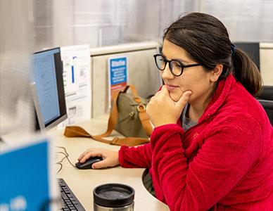 student at a computer preparing for class