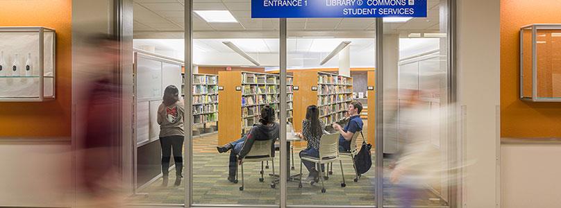 group of students working on a team project in library