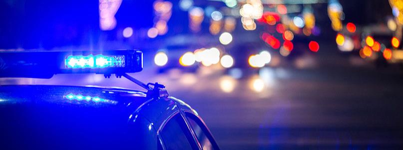 police car lights with traffic in the background