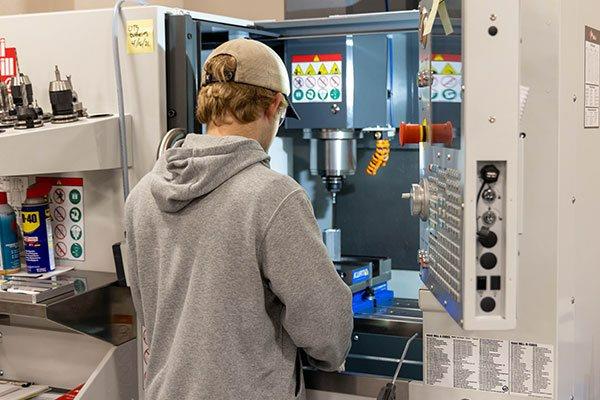 engineering student working on equipment