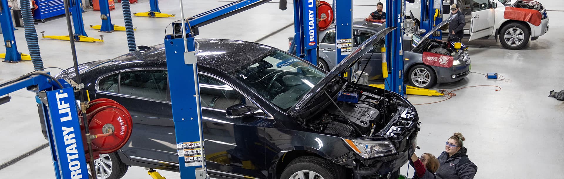 automotive service shop with cars on lifts